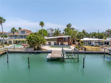 A unique, Mid-Century Modern home located on highly sought-after on Treasure Bay Golf and Tennis in Florida - for sale on GolfHomes.com, golf home, golf lot