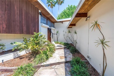 A unique, Mid-Century Modern home located on highly sought-after on Treasure Bay Golf and Tennis in Florida - for sale on GolfHomes.com, golf home, golf lot