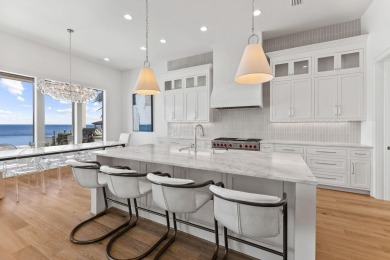 480 Captains Circle is an extraordinary waterfront estate within on Regatta Bay Golf and Country Club in Florida - for sale on GolfHomes.com, golf home, golf lot