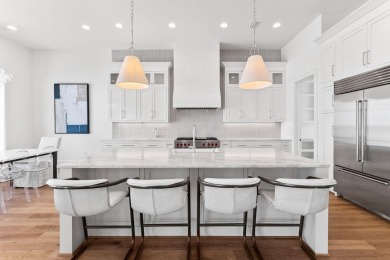 480 Captains Circle is an extraordinary waterfront estate within on Regatta Bay Golf and Country Club in Florida - for sale on GolfHomes.com, golf home, golf lot
