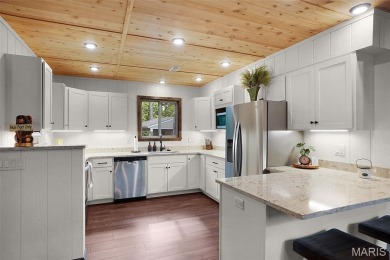 Completed in March 2025, this nearly brand-new chalet features on Innsbrook Resort Golf Course in Missouri - for sale on GolfHomes.com, golf home, golf lot