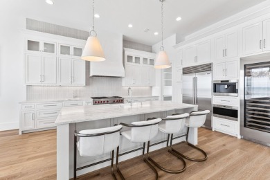 480 Captains Circle is an extraordinary waterfront estate within on Regatta Bay Golf and Country Club in Florida - for sale on GolfHomes.com, golf home, golf lot