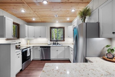 Completed in March 2025, this nearly brand-new chalet features on Innsbrook Resort Golf Course in Missouri - for sale on GolfHomes.com, golf home, golf lot