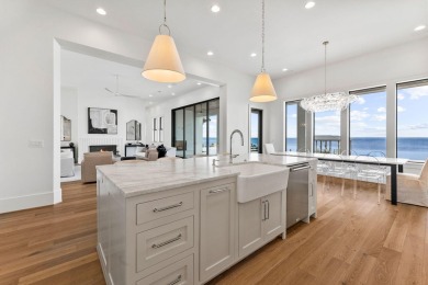 480 Captains Circle is an extraordinary waterfront estate within on Regatta Bay Golf and Country Club in Florida - for sale on GolfHomes.com, golf home, golf lot