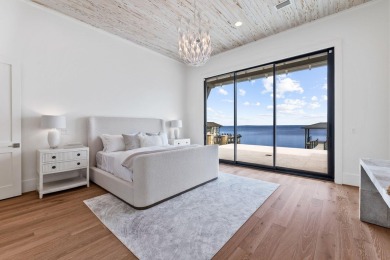 480 Captains Circle is an extraordinary waterfront estate within on Regatta Bay Golf and Country Club in Florida - for sale on GolfHomes.com, golf home, golf lot
