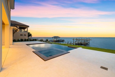480 Captains Circle is an extraordinary waterfront estate within on Regatta Bay Golf and Country Club in Florida - for sale on GolfHomes.com, golf home, golf lot