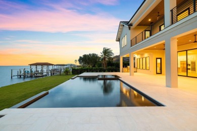 480 Captains Circle is an extraordinary waterfront estate within on Regatta Bay Golf and Country Club in Florida - for sale on GolfHomes.com, golf home, golf lot
