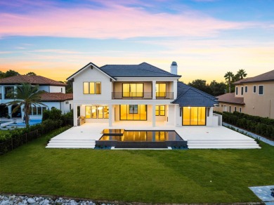 480 Captains Circle is an extraordinary waterfront estate within on Regatta Bay Golf and Country Club in Florida - for sale on GolfHomes.com, golf home, golf lot