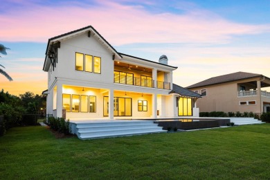 480 Captains Circle is an extraordinary waterfront estate within on Regatta Bay Golf and Country Club in Florida - for sale on GolfHomes.com, golf home, golf lot