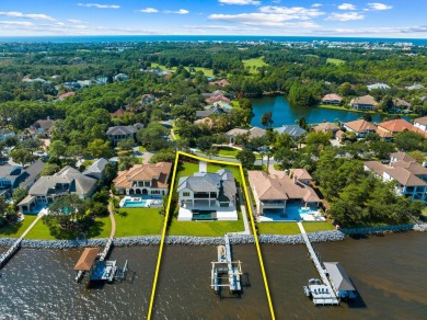 480 Captains Circle is an extraordinary waterfront estate within on Regatta Bay Golf and Country Club in Florida - for sale on GolfHomes.com, golf home, golf lot