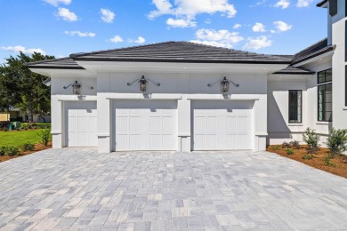 480 Captains Circle is an extraordinary waterfront estate within on Regatta Bay Golf and Country Club in Florida - for sale on GolfHomes.com, golf home, golf lot