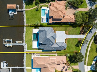 480 Captains Circle is an extraordinary waterfront estate within on Regatta Bay Golf and Country Club in Florida - for sale on GolfHomes.com, golf home, golf lot