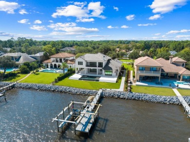 480 Captains Circle is an extraordinary waterfront estate within on Regatta Bay Golf and Country Club in Florida - for sale on GolfHomes.com, golf home, golf lot