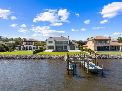 480 Captains Circle is an extraordinary waterfront estate within on Regatta Bay Golf and Country Club in Florida - for sale on GolfHomes.com, golf home, golf lot