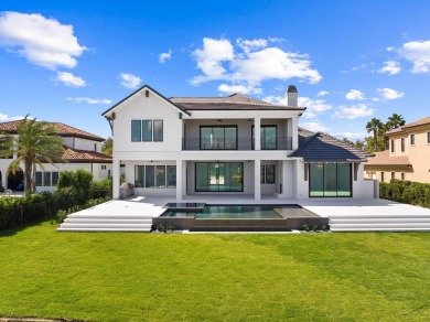 480 Captains Circle is an extraordinary waterfront estate within on Regatta Bay Golf and Country Club in Florida - for sale on GolfHomes.com, golf home, golf lot