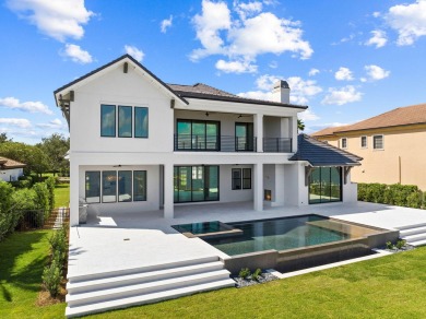 480 Captains Circle is an extraordinary waterfront estate within on Regatta Bay Golf and Country Club in Florida - for sale on GolfHomes.com, golf home, golf lot