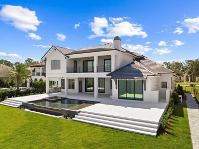 480 Captains Circle is an extraordinary waterfront estate within on Regatta Bay Golf and Country Club in Florida - for sale on GolfHomes.com, golf home, golf lot