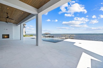 480 Captains Circle is an extraordinary waterfront estate within on Regatta Bay Golf and Country Club in Florida - for sale on GolfHomes.com, golf home, golf lot
