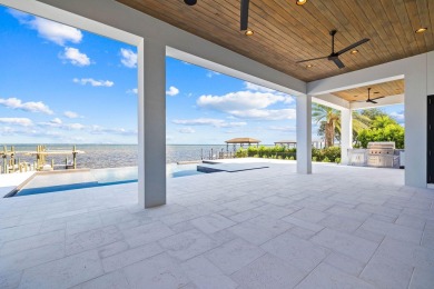 480 Captains Circle is an extraordinary waterfront estate within on Regatta Bay Golf and Country Club in Florida - for sale on GolfHomes.com, golf home, golf lot