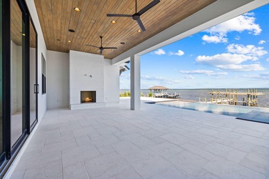 480 Captains Circle is an extraordinary waterfront estate within on Regatta Bay Golf and Country Club in Florida - for sale on GolfHomes.com, golf home, golf lot