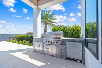 480 Captains Circle is an extraordinary waterfront estate within on Regatta Bay Golf and Country Club in Florida - for sale on GolfHomes.com, golf home, golf lot