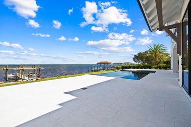 480 Captains Circle is an extraordinary waterfront estate within on Regatta Bay Golf and Country Club in Florida - for sale on GolfHomes.com, golf home, golf lot