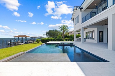 480 Captains Circle is an extraordinary waterfront estate within on Regatta Bay Golf and Country Club in Florida - for sale on GolfHomes.com, golf home, golf lot