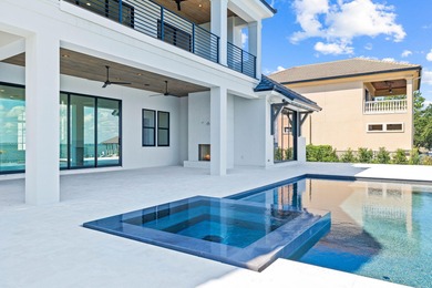 480 Captains Circle is an extraordinary waterfront estate within on Regatta Bay Golf and Country Club in Florida - for sale on GolfHomes.com, golf home, golf lot