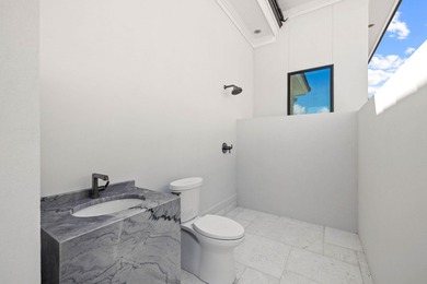 480 Captains Circle is an extraordinary waterfront estate within on Regatta Bay Golf and Country Club in Florida - for sale on GolfHomes.com, golf home, golf lot