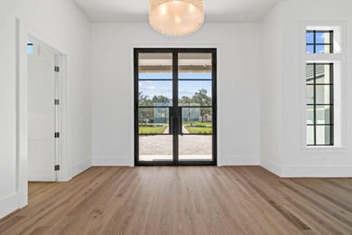 480 Captains Circle is an extraordinary waterfront estate within on Regatta Bay Golf and Country Club in Florida - for sale on GolfHomes.com, golf home, golf lot