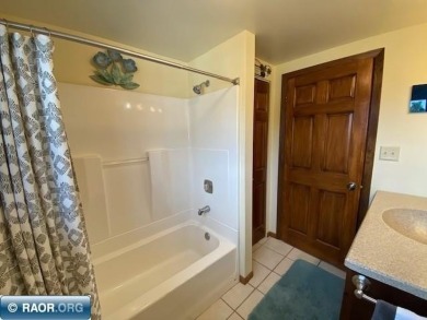 Discover this inviting 3-bedroom, 1.75-bathroom home on Virginia Golf Course in Minnesota - for sale on GolfHomes.com, golf home, golf lot