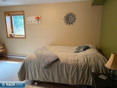 Discover this inviting 3-bedroom, 1.75-bathroom home on Virginia Golf Course in Minnesota - for sale on GolfHomes.com, golf home, golf lot