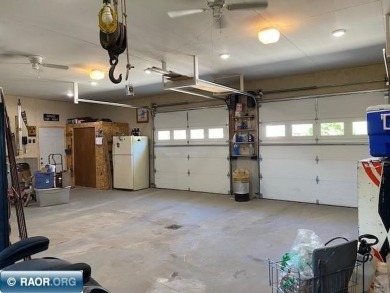 Discover this inviting 3-bedroom, 1.75-bathroom home on Virginia Golf Course in Minnesota - for sale on GolfHomes.com, golf home, golf lot