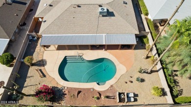 Welcome to this beautifully designed single-level home featuring on Sun City Lakes West and East in Arizona - for sale on GolfHomes.com, golf home, golf lot