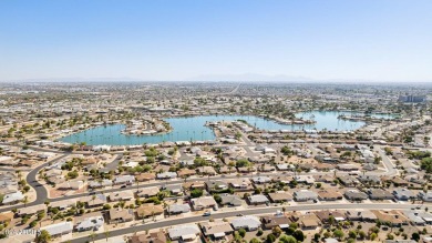 Welcome to this beautifully designed single-level home featuring on Sun City Lakes West and East in Arizona - for sale on GolfHomes.com, golf home, golf lot