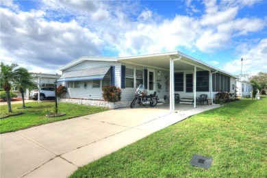 This charming home in the sought-after flower section of on Barefoot Bay Golf Course in Florida - for sale on GolfHomes.com, golf home, golf lot