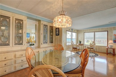 This charming home in the sought-after flower section of on Barefoot Bay Golf Course in Florida - for sale on GolfHomes.com, golf home, golf lot