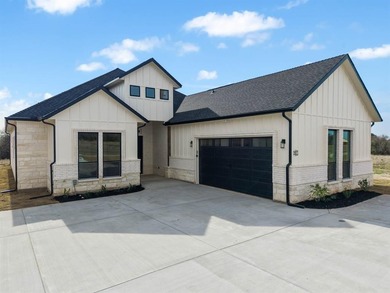 Discover elegance and modern living in this newly constructed on White Bluff Resort - New Course in Texas - for sale on GolfHomes.com, golf home, golf lot