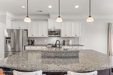 This stunning modern Low Country-style home is perfectly on Members Club At St. James Plantation in North Carolina - for sale on GolfHomes.com, golf home, golf lot