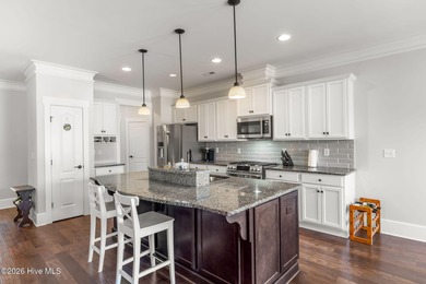 This stunning modern Low Country-style home is perfectly on Members Club At St. James Plantation in North Carolina - for sale on GolfHomes.com, golf home, golf lot