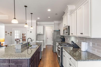 This stunning modern Low Country-style home is perfectly on Members Club At St. James Plantation in North Carolina - for sale on GolfHomes.com, golf home, golf lot