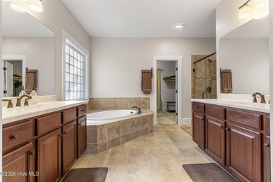 This stunning modern Low Country-style home is perfectly on Members Club At St. James Plantation in North Carolina - for sale on GolfHomes.com, golf home, golf lot