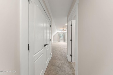 This stunning modern Low Country-style home is perfectly on Members Club At St. James Plantation in North Carolina - for sale on GolfHomes.com, golf home, golf lot