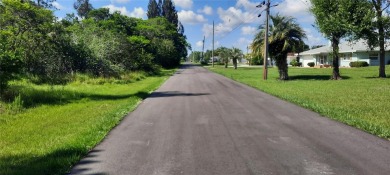 Come build your forever home on this one-half acre CANAL lot on Indian Lake Estates Golf and Country Club in Florida - for sale on GolfHomes.com, golf home, golf lot