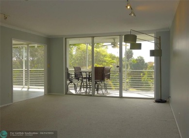 OUTSTANDING GOLF COURSE VIEWS from this 3 bedroom 2 bath bright on Palm-Aire Country Club and Resort - Palms in Florida - for sale on GolfHomes.com, golf home, golf lot