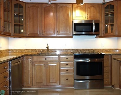 OUTSTANDING GOLF COURSE VIEWS from this 3 bedroom 2 bath bright on Palm-Aire Country Club and Resort - Palms in Florida - for sale on GolfHomes.com, golf home, golf lot