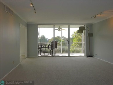 OUTSTANDING GOLF COURSE VIEWS from this 3 bedroom 2 bath bright on Palm-Aire Country Club and Resort - Palms in Florida - for sale on GolfHomes.com, golf home, golf lot