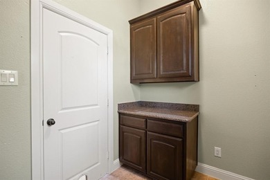 Beautiful 3-bedroom, 2.5-bath home with an oversized 3-car on Pecan Plantation Country Club in Texas - for sale on GolfHomes.com, golf home, golf lot