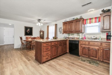 This 3-bedroom, 2-bathroom home sits on a corner lot in the on West Plains Country Club in Missouri - for sale on GolfHomes.com, golf home, golf lot