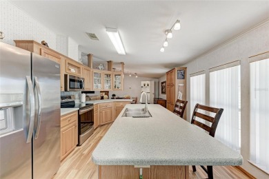 Welcome to this 3-bedroom, 2-bath fully furnished turnkey mobile on Kings Gate Golf Club in Florida - for sale on GolfHomes.com, golf home, golf lot